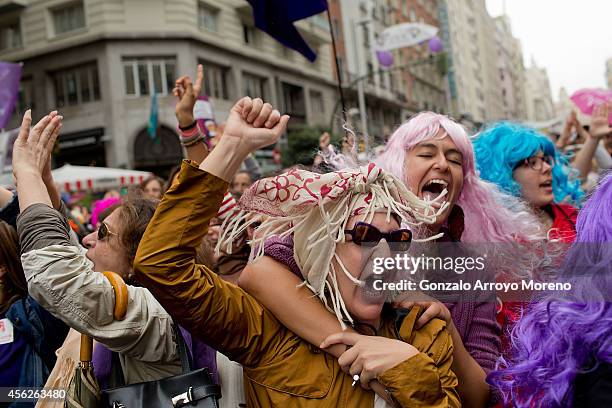 Women celebrate during a demonstration supporting reproductive rights for women on September 28, 2014 in Madrid, Spain. During an international day...