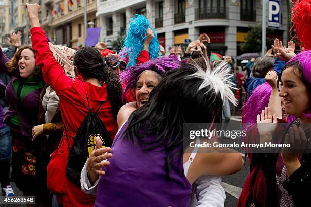 Women celebrate the Spanish govermment new abortion law withdrawal and the resignation of Justice Minister Alberto Ruiz-Gallardon during a...