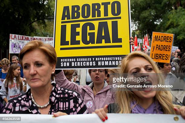 Woman holds a sign claiming for a legal abortion during a demonstration supporting reproductive rights for women on September 28, 2014 in Madrid,...