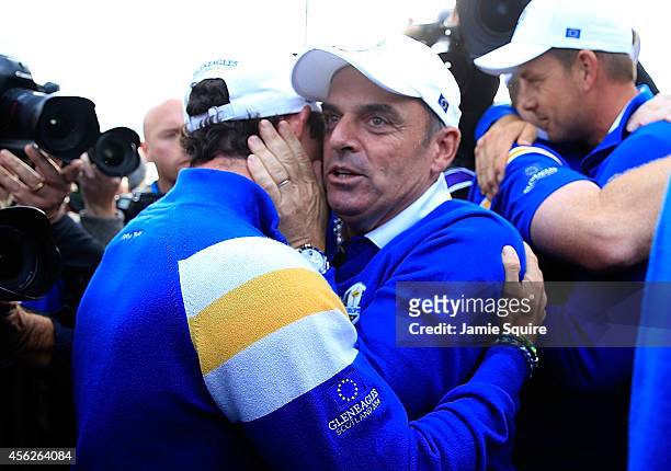 Europe team captain Paul McGinley celebrates on the 15th hole with Rory McIlroy after Europe won the Ryder Cup with Jamie Donaldson defeating Keegan...