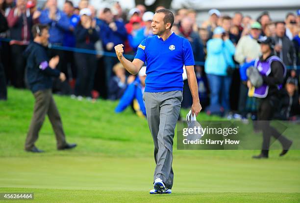 Sergio Garcia of Europe celebrates winning his match against Jim Furyk of the United States on the 18th green during the Singles Matches of the 2014...