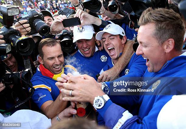 Sergio Garcia, Lee Westwood, Rory McIlroy and Ian Poulter of Europe celebrate winning the Ryder Cup after the Singles Matches of the 2014 Ryder Cup...