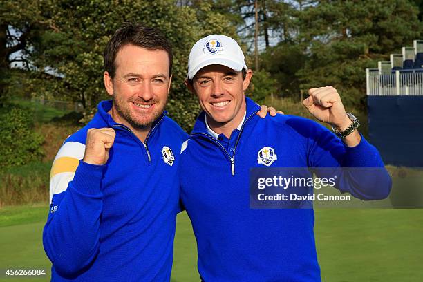 Graeme McDowell and Rory McIlroy of Europe celebrate winning the Ryder Cup after Jamie Donaldson of Europe defeated Keegan Bradley of the United...