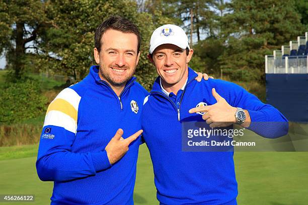 Graeme McDowell and Rory McIlroy of Europe celebrate winning the Ryder Cup after Jamie Donaldson of Europe defeated Keegan Bradley of the United...