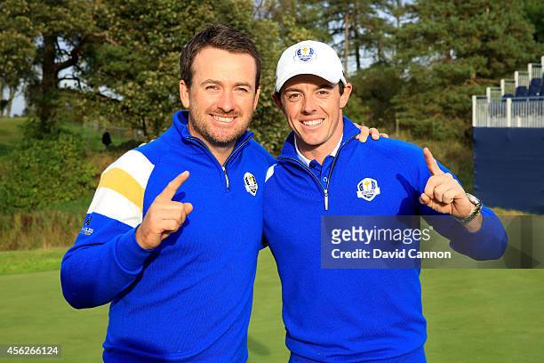 Graeme McDowell and Rory McIlroy of Europe celebrate winning the Ryder Cup after Jamie Donaldson of Europe defeated Keegan Bradley of the United...