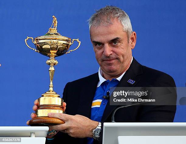 Europe team captain Paul McGinley poses with the Ryder Cup trophy after the Singles Matches of the 2014 Ryder Cup on the PGA Centenary course at the...