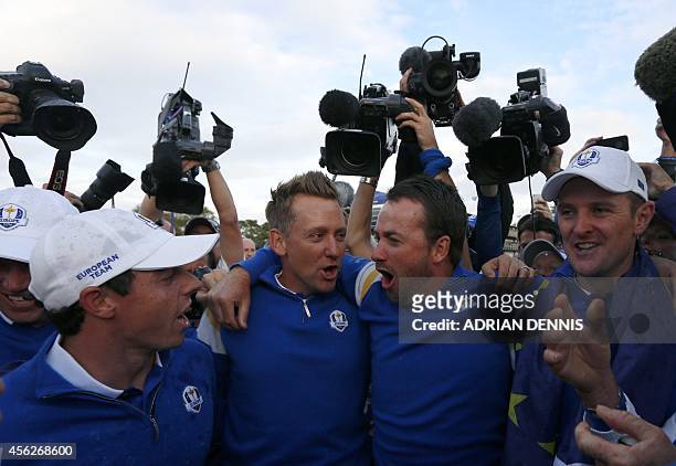 Team Europe players Rory McIlroy of Northern Ireland, Ian Poulter of England, Stephen Gallacher of Scotland and Justin Rose of England celebrate...