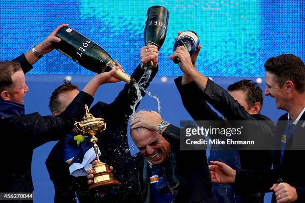 Europe team captain Paul McGinley celebrates winning the Ryder Cup with his team after the Singles Matches of the 2014 Ryder Cup on the PGA Centenary...