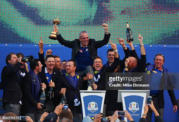 Europe team captain Paul McGinley celebrates winning the Ryder Cup with his team after the Singles Matches of the 2014 Ryder Cup on the PGA Centenary...