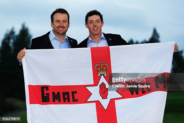 Graeme McDowell and Rory McIlroy of Europe celebrate winning the Ryder Cup after the Singles Matches of the 2014 Ryder Cup on the PGA Centenary...