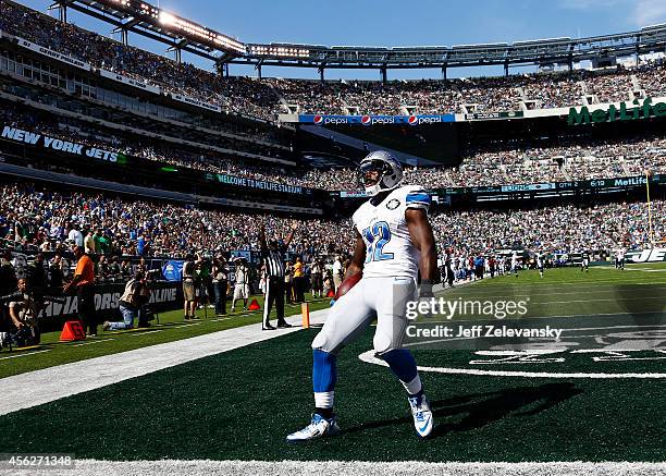 Jeremy Ross of the Detroit Lions celebrates scoring a 59-yard touchdown in the in the second quarter against the New York Jets at MetLife Stadium on...