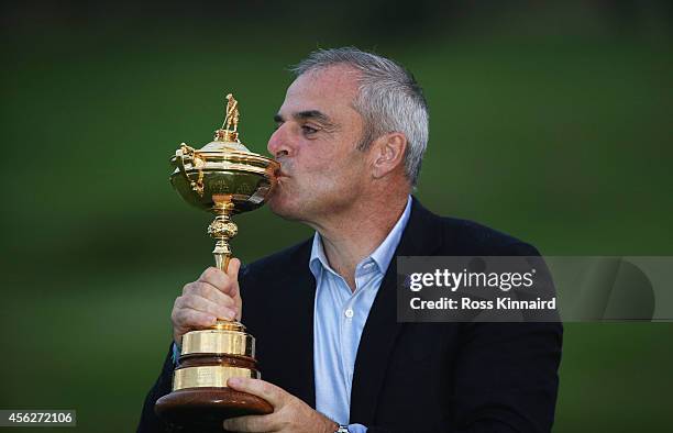 Europe team captain Paul McGinley kisses the Ryder Cup trophy after the Singles Matches of the 2014 Ryder Cup on the PGA Centenary course at the...