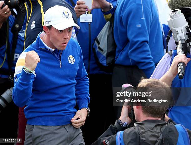 Rory McIlroy of Europe celebrates during the Singles Matches of the 2014 Ryder Cup on the PGA Centenary course at the Gleneagles Hotel on September...