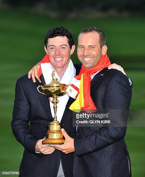 Rory McIlroy of Northern Ireland and Sergio Garcia of Spain pose for photographs after Team Europe retained the Ryder Cup on the final day of the...