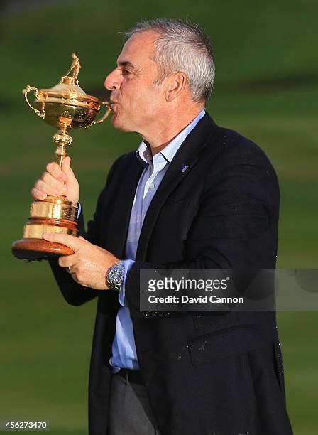 Europe team captain Paul McGinley kisses the Ryder Cup trophy after the Singles Matches of the 2014 Ryder Cup on the PGA Centenary course at the...
