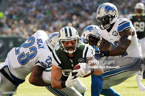 Eric Decker of the New York Jets scores a touchdown in the third quarter against the defense of Darius Slay of the Detroit Lions at MetLife Stadium...