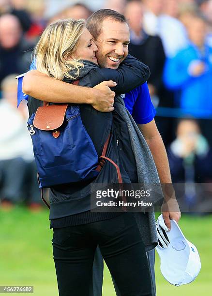 Sergio Garcia of Europe celebrates with Katharina Boehm during the Singles Matches of the 2014 Ryder Cup on the PGA Centenary course at the...