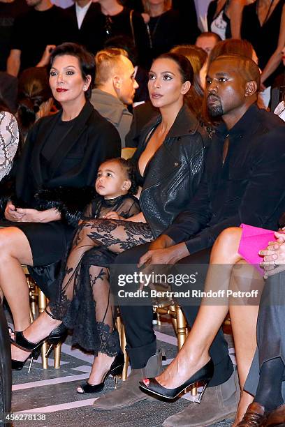 Mother of Kim Kardashian, Kris Jenner, Kim Kardashian, Kanye West and their daughter North West attend the Givenchy show as part of the Paris Fashion...