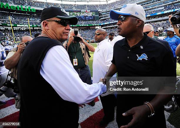 Head coach Rex Ryan of the New York Jets shakes hands with head coach Jim Caldwell of the Detroit Lions after the Lions defeated the Jets 24 to 17 at...