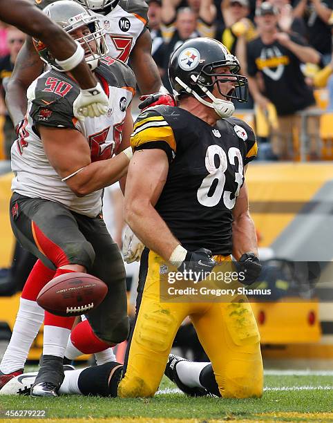 Heath Miller of the Pittsburgh Steelers celebrates his touchdown during the third quarter against the Tampa Bay Buccaneers at Heinz Field on...