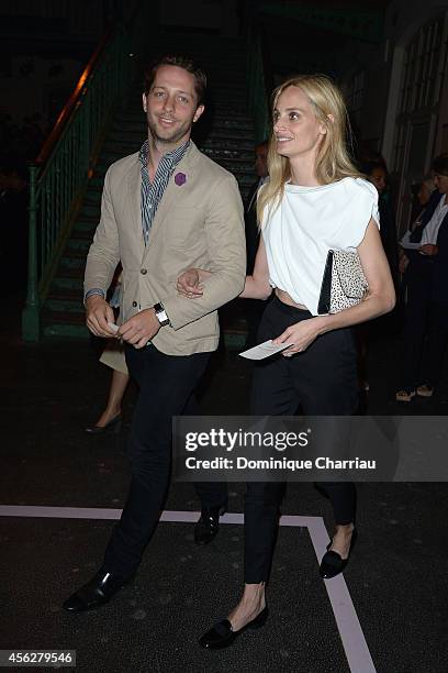 Derek Blasberg and a guest attend the Givenchy show as part of the Paris Fashion Week Womenswear Spring/Summer 2015 on September 28, 2014 in Paris,...