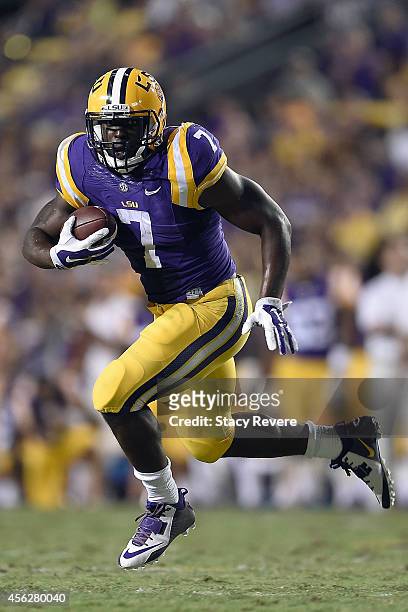 Leonard Fournette of the LSU Tigers runs for yards during a game against the New Mexico State Aggies at Tiger Stadium on September 27, 2014 in Baton...