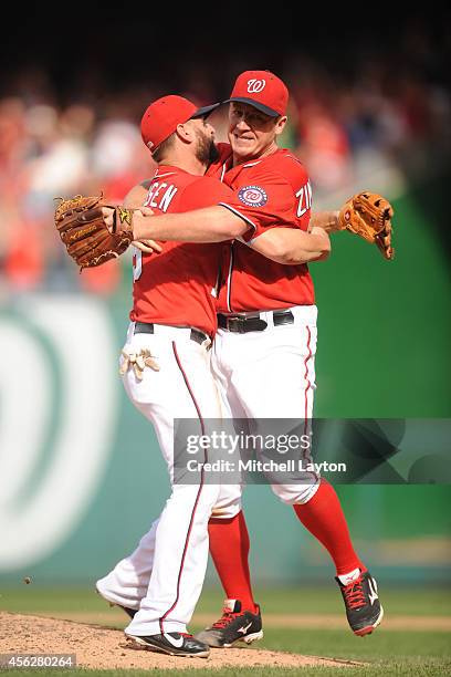 Jordan Zimmermann of the Washington Nationals celebrates his no-hitter with Kevin Frandsen after a baseball game against the Miami Marlins on...