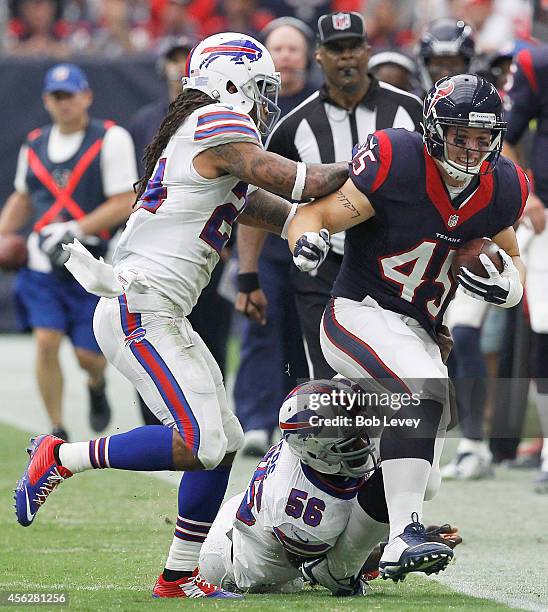 Jay Prosch of the Houston Texans is tackled by Keith Rivers of the Buffalo Bill gives chase in the fourth quarter in a NFL game on September 28, 2014...
