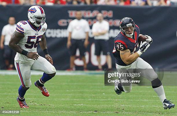 Jay Prosch of the Houston Texans runs after the pass while Keith Rivers of the Buffalo Bill gives chase in the fourth quarter in a NFL game on...