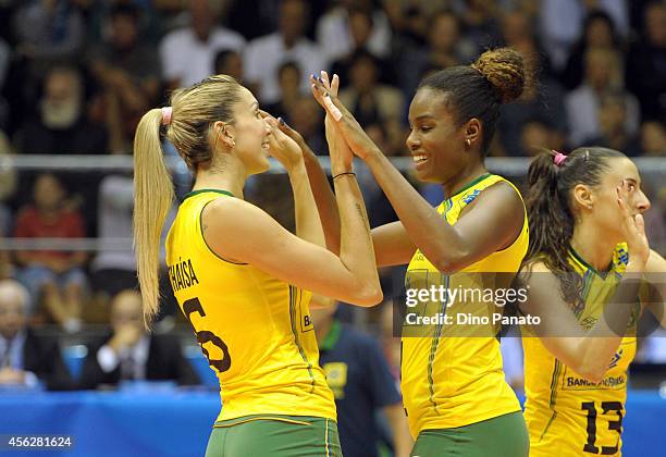 Thaisa Menezes and Fabiana Claudino of Brazil celebrate victory after the FIVB Women's World Championship pool Brankica Mihajlovic of Serbia B match...