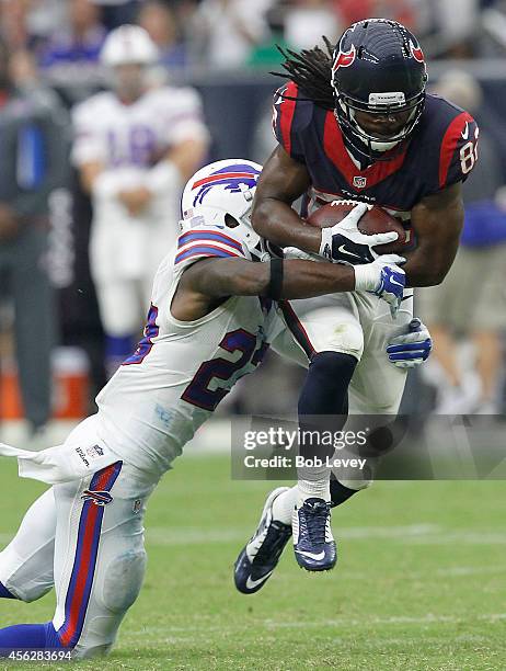 Keshawn Martin of the Houston Texans is tackled by Mike Williams of the Buffalo Bills in the fourth quarter in a NFL game on September 28, 2014 at...