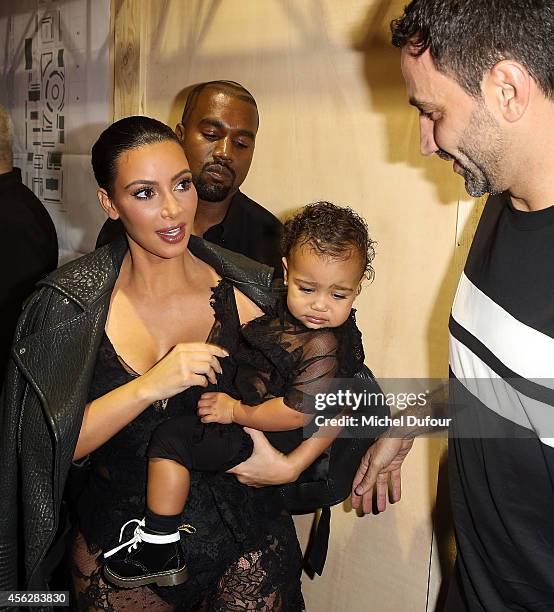 Kanye West, Kim Kardashian, North West and designer Ricardo Tisci attend the Givenchy show as part of the Paris Fashion Week Womenswear Spring/Summer...