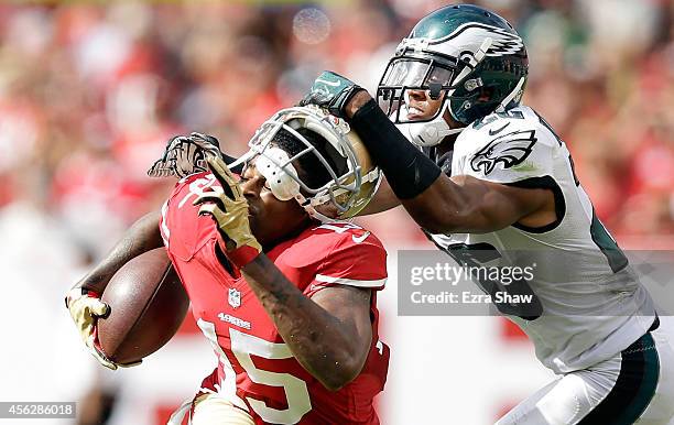 Cary Williams of the Philadelphia Eagles pulls the helmet off of Michael Crabtree of the San Francisco 49ers during the second quarter at Levi's...