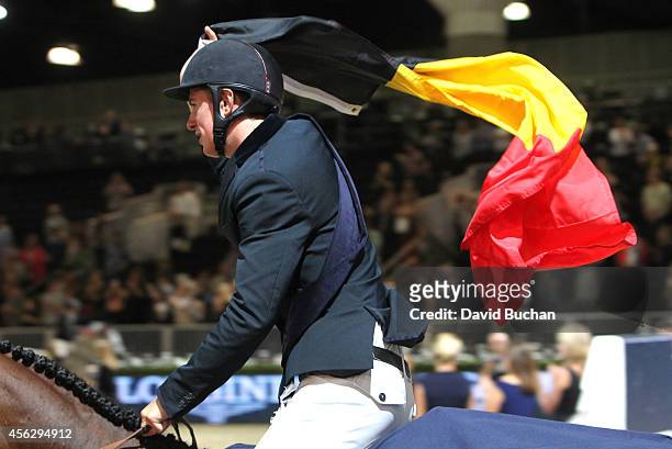 Rider Jos Verlooy of Belgium celebrates his first place finish in the Longines Grand Prix class as part of the Longines Los Angeles Masters at Los...