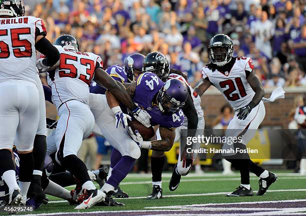 Matt Asiata of the Minnesota Vikings scores a touchdown against the Atlanta Falcons during the fourth quarter of the game on September 28, 2014 at...