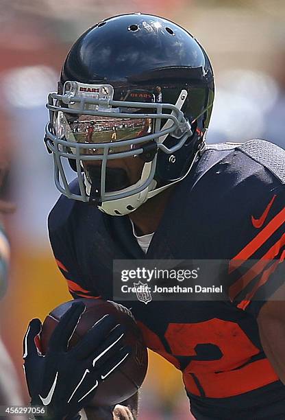 Matt Forte of the Chicago Bears runs the ball against the Green Bay Packers during the second half at Soldier Field on September 28, 2014 in Chicago,...