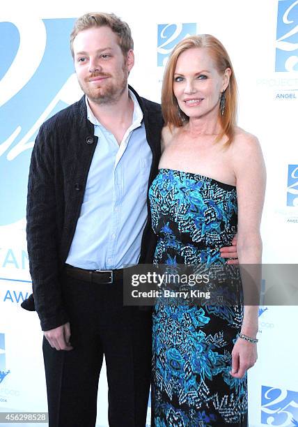 Actress Marg Helgenberger and Howard Rosenberg arrive for Project Angel Food Celebrates 25 Years With 2014 Angel Awards at Project Angel Food on...