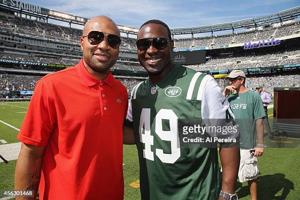 New York Knicks Head Coach Derek Fisher and former New York Jets fullback Tony Richardson attend the Detroit Lions vs New York Jets Game at MetLife...