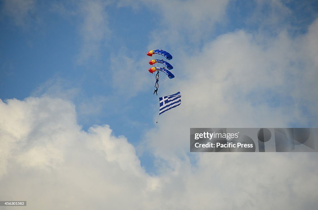 Members of the Skydiver team from Romania parachute hold a...