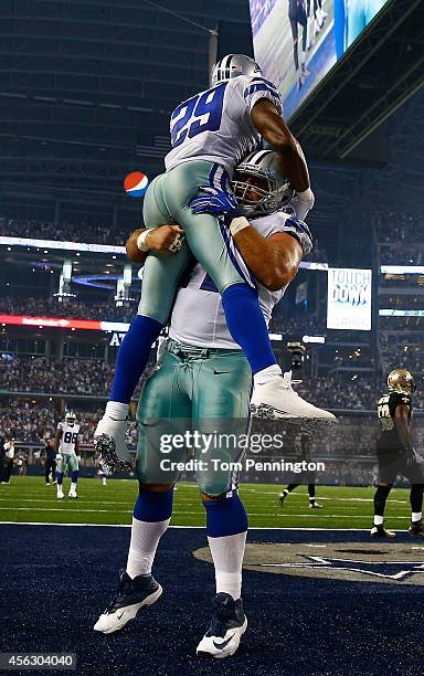 DeMarco Murray of the Dallas Cowboys and Travis Frederick of the Dallas Cowboys celebrate Murray's touchdown against the New Orleans Saints in the...