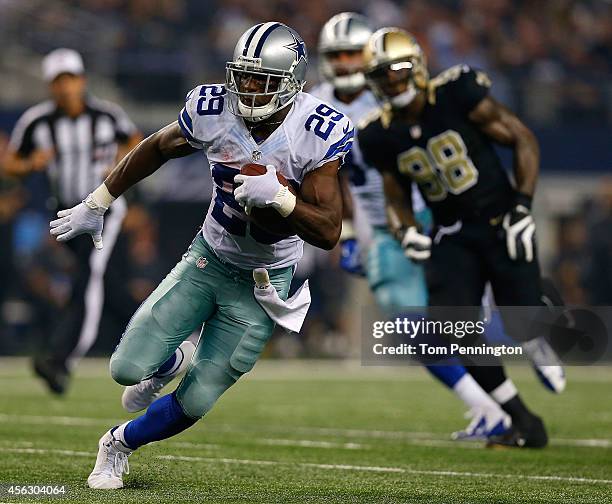 DeMarco Murray of the Dallas Cowboys runs for a touchdown against the New Orleans Saints in the second half at AT&T Stadium on September 28, 2014 in...