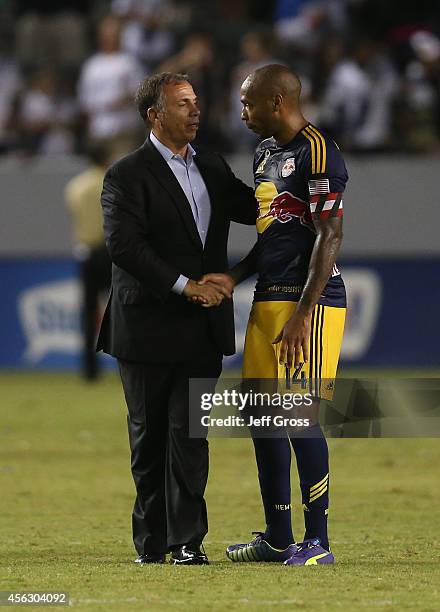 Los Angeles Galaxy head coach Bruce Arena shakes hands with Thierry Henry of New York Red Bulls following the game at StubHub Center on September 28,...