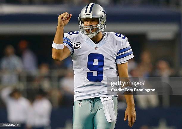 Tony Romo of the Dallas Cowboys celebrates a first down against the New Orleans Saints in the second half at AT&T Stadium on September 28, 2014 in...