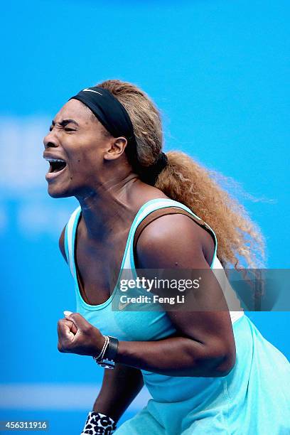 Serena Williams of the United States celebrates a ball against Silvia Soler-Espinosa of Spain during day three of the China Open at the China...