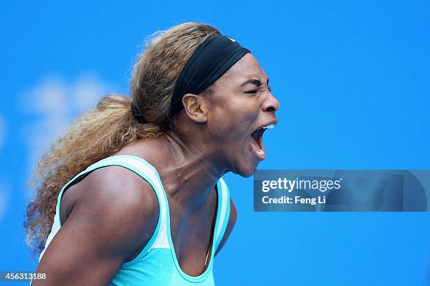 Serena Williams of the United States celebrates a ball against Silvia Soler-Espinosa of Spain during day three of the China Open at the China...