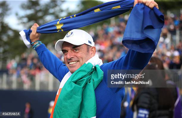 Paul McGinley celebrates as Europe retain the Ryder Cup during the Singles Matches of the 2014 Ryder Cup on the PGA Centenary course at the...