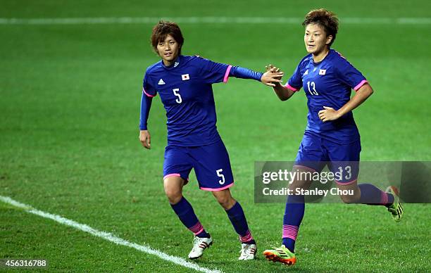 Yuika Sugasawa of Japan celebrates with Kana Osafune after scoring against Vietnam during the Women's Football Semi-Final match bewteen Vietnam and...