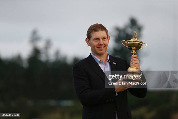 Stephen Gallacher celebrates as Europe retain the Ryder Cup during the Singles Matches of the 2014 Ryder Cup on the PGA Centenary course at the...