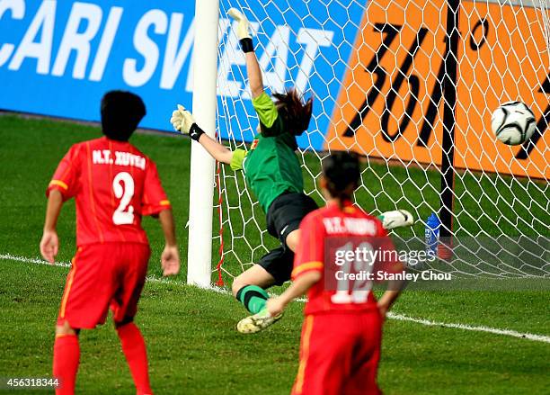 Dang Thi Kieu Trinh goalkeeper of Vietnam is beaten by Kana Osafune of Japan during the Women's Football Semi-Final match bewteen Vietnam and Japan...