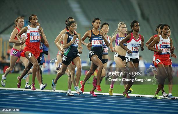 Maryam Yusuf Isa Jamal of Bahrain leads the pack in the Women's 1500m during day ten of the 2014 Asian Games at Incheon Asiad Main Stadium on...